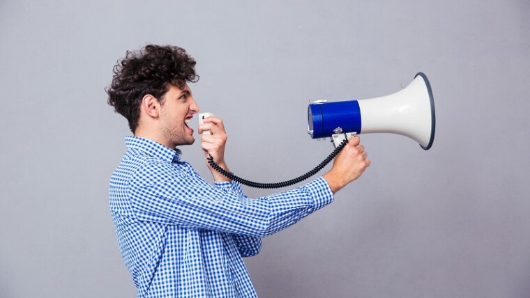 Casual Man Shouting On Megaphone