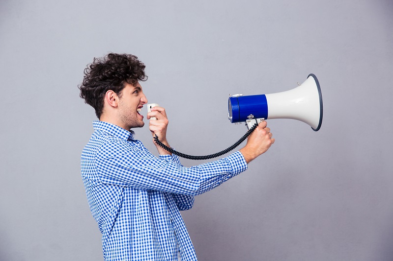 Casual Man Shouting On Megaphone